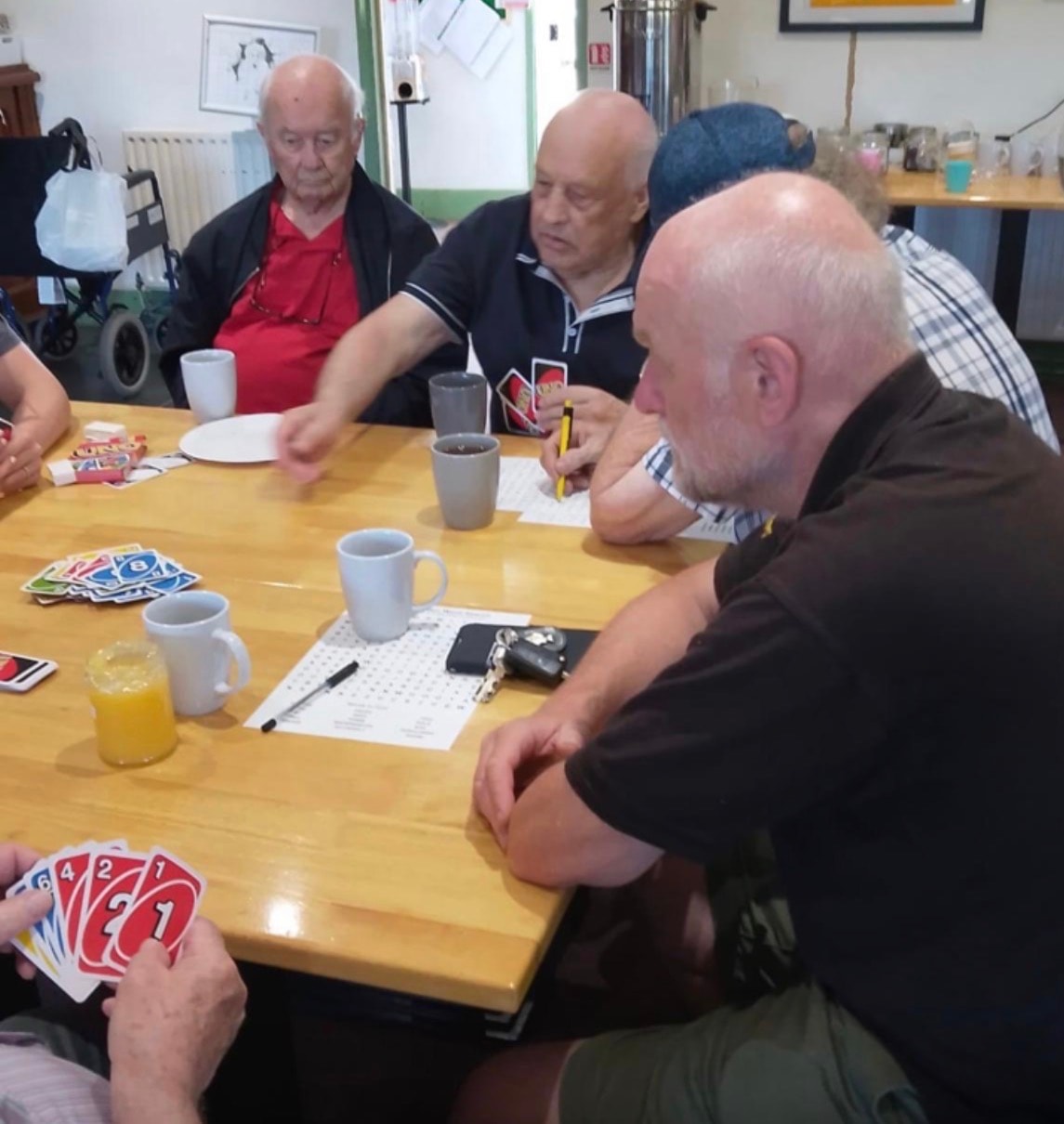 Seniors playing a card game together