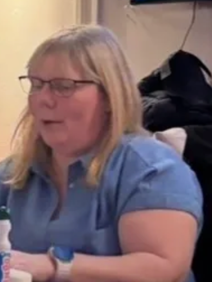 Community member in a blue shirt at a group session